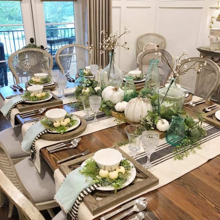 Green Foliage and White Pumpkins